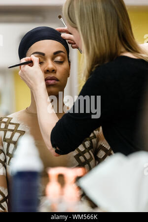 Hamburg, Germany. 14th Aug, 2019. The swiss singer Melina M`Poy is wearing make-up in her mask. As the first cast she plays the Nala in the Hamburg production of the musical König der Löwen. Credit: Markus Scholz/dpa/Alamy Live News Stock Photo